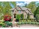 Beautiful brick home with lush landscaping and a well-maintained front yard at 187 Stoney Creek Way, Chapel Hill, NC 27517