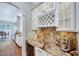 Gourmet coffee bar features a wine cooler, built-in cabinets, and granite countertops at 187 Stoney Creek Way, Chapel Hill, NC 27517