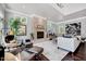 Spacious living room with hardwood floors, a stone fireplace, and plenty of natural light at 187 Stoney Creek Way, Chapel Hill, NC 27517