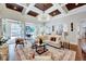 Cozy living room featuring a decorative ceiling, fireplace and french doors at 187 Stoney Creek Way, Chapel Hill, NC 27517