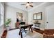 Comfortable home office with wooden desk, ceiling fan, and stylish décor at 187 Stoney Creek Way, Chapel Hill, NC 27517