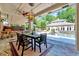 Outdoor patio with dining table and chairs, view of a pool and the yard at 187 Stoney Creek Way, Chapel Hill, NC 27517
