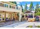 Outdoor patio featuring a dining table, a built-in outdoor kitchen, and a grill at 187 Stoney Creek Way, Chapel Hill, NC 27517