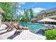 Luxury pool with lounge chairs, waterfall feature and beautiful landscaping at 187 Stoney Creek Way, Chapel Hill, NC 27517