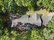 An aerial perspective reveals a home bordered by vibrant green trees at 2001 Lovdal Dr, Raleigh, NC 27613