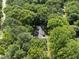 Aerial view of a home surrounded by lush green trees at 2001 Lovdal Dr, Raleigh, NC 27613