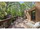 Spacious wooden back deck offers an inviting outdoor space with seating, ideal for relaxation and entertaining at 2001 Lovdal Dr, Raleigh, NC 27613