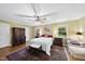 Comfortable bedroom features natural light, ceiling fan, and a calm, inviting decor at 2001 Lovdal Dr, Raleigh, NC 27613