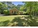 An inviting brick home nestled within a serene, tree-filled landscape for a peaceful setting at 2001 Lovdal Dr, Raleigh, NC 27613