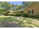 Traditional brick home with manicured shrubs, offering a welcoming and classic curb appeal at 2001 Lovdal Dr, Raleigh, NC 27613