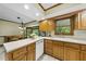 Well-lit kitchen with plenty of counter space, wood cabinets and adjacent breakfast nook at 2001 Lovdal Dr, Raleigh, NC 27613