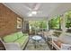 Relaxing screened-in porch features comfortable seating and scenic views of the lush outdoors at 2001 Lovdal Dr, Raleigh, NC 27613