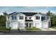 Beautiful new construction townhomes with attached garages and manicured lawns at 2015 Oakdale Dr, Durham, NC 27703
