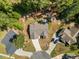 An aerial view shows the home situated on a cul-de-sac, with a well-manicured lawn at 217 Griffis Dr, Stem, NC 27581