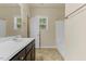 Bright bathroom featuring a double vanity, tub and shower combo, and neutral color scheme at 217 Griffis Dr, Stem, NC 27581