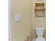 Bathroom with a toilet, and an oval shelving unit for organization at 217 Griffis Dr, Stem, NC 27581