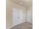 Neutral bedroom with carpet and double closet featuring modern white doors at 217 Griffis Dr, Stem, NC 27581