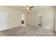 Large bedroom with a ceiling fan and attached bathroom and walk-in closet at 217 Griffis Dr, Stem, NC 27581