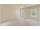 Large bedroom with a ceiling fan and two windows providing natural light at 217 Griffis Dr, Stem, NC 27581