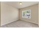 A bedroom featuring a neutral color scheme and a window providing natural light at 217 Griffis Dr, Stem, NC 27581