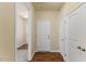 Hallway of home features wood floors, multiple doors, and neutral paint at 217 Griffis Dr, Stem, NC 27581