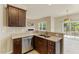 Updated kitchen with granite countertops, dark wood cabinets and stainless steel appliances at 217 Griffis Dr, Stem, NC 27581