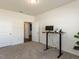 Bedroom featuring an adjustable height desk and ensuite bathroom at 218 E Tecoma Ln, Clayton, NC 27520