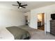Spacious primary bedroom boasts carpet flooring and access to the ensuite bathroom and walk-in closet at 218 E Tecoma Ln, Clayton, NC 27520