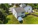 Aerial view of the backyard, wooden fence, and lush green lawn with a patio set at 228 Honeywell Way, Fuquay Varina, NC 27526