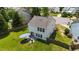 Aerial view of backyard with patio set and lush green lawn, with a wooden fence at 228 Honeywell Way, Fuquay Varina, NC 27526