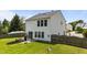 A partial view of the backyard, with a patio seating area and lush green grass at 228 Honeywell Way, Fuquay Varina, NC 27526