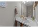 A well-lit bathroom features a vanity with a sink, a mirror, and decorative accents at 228 Honeywell Way, Fuquay Varina, NC 27526