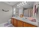The bathroom features a white vanity with double sinks and a shower-tub combination at 228 Honeywell Way, Fuquay Varina, NC 27526