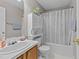Bright bathroom with a shower-tub combination and storage space at 228 Honeywell Way, Fuquay Varina, NC 27526