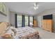Bright bedroom with vaulted ceiling, ceiling fan, and multiple windows offering natural light at 228 Honeywell Way, Fuquay Varina, NC 27526