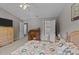 Bedroom featuring a vaulted ceiling, ceiling fan, and a classic wooden writing desk at 228 Honeywell Way, Fuquay Varina, NC 27526