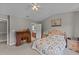 Bedroom featuring a vaulted ceiling, ceiling fan, and a classic wooden writing desk at 228 Honeywell Way, Fuquay Varina, NC 27526