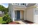 Inviting front entrance with a blue door, decorative shrubbery, and attractive landscaping at 228 Honeywell Way, Fuquay Varina, NC 27526