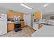 Practical kitchen with wood cabinets, modern appliances, and an efficient layout at 228 Honeywell Way, Fuquay Varina, NC 27526