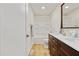 Bathroom with double vanity, wood cabinets, and shower-tub combination at 2311 Wintergreen Pl, Durham, NC 27707