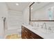 Bathroom with a double vanity, wood cabinets, and shower-tub combination at 2311 Wintergreen Pl, Durham, NC 27707