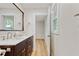 Bathroom featuring a double sink vanity, and a large framed mirror at 2311 Wintergreen Pl, Durham, NC 27707
