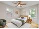 Sun-filled bedroom with a ceiling fan, hardwood floors, and a neutral color scheme at 2311 Wintergreen Pl, Durham, NC 27707