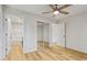Bright bedroom with ceiling fan, laminate floors and a sliding door closet at 2311 Wintergreen Pl, Durham, NC 27707