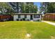 Charming, freshly painted home with a well-manicured lawn and inviting curb appeal at 2311 Wintergreen Pl, Durham, NC 27707