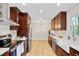 Beautiful kitchen featuring stainless appliances, wood cabinets, and a farmhouse sink at 2311 Wintergreen Pl, Durham, NC 27707