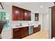 Bright kitchen with wood cabinets, stainless appliances, quartz counters, and natural light at 2311 Wintergreen Pl, Durham, NC 27707