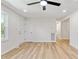 Clean, freshly painted living room showcasing the hardwood floors and bright natural light at 2311 Wintergreen Pl, Durham, NC 27707