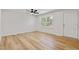 Open floor plan living room with neutral paint and updated flooring at 2311 Wintergreen Pl, Durham, NC 27707