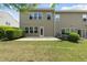 Backyard showcasing lawn, patio, and the home's exterior at 245 Kylemore Cir, Cary, NC 27513